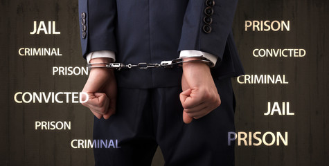 Jail convicted prison criminal labels with close handcuffed man
