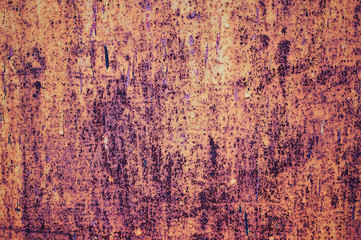 An old painted sheet of iron covered with rust. Abstract background.