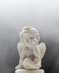 Fototapeta na wymiar Baby Angel On Smoky Background 2
