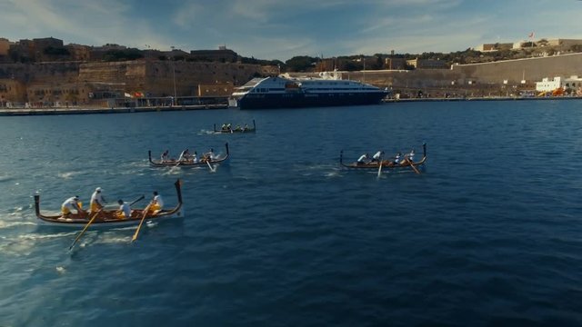 Boats racing in Malta Grand Harbour