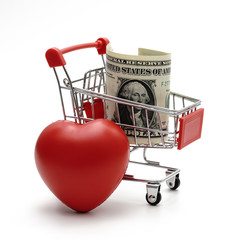 dollar money and heart with Shopping Cart On White Background Shot In Studio