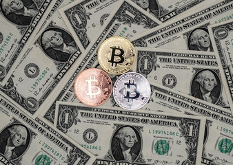 Bitcoin and banknotes of one dollar. Exchange bitcoin for a dollar