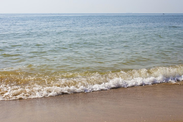 Soft wave of the sea on the sandy beach