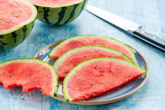Slices of watermelon on a plate - top view. Refreshing summer fruit