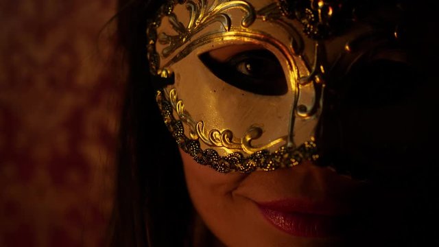 mysterious woman in a golden Venetian mask