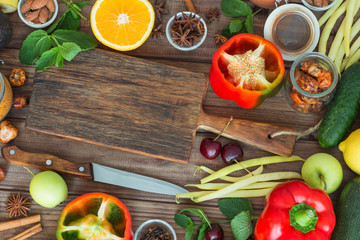 Healthy food, clean food selection:  fruits, vegetables, seeds, spices on brown boards with free space in the middle