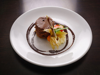 Hot Chocolate Sponge Cake Served with Strawberries, Chocolate Rolls and a Cape Gooseberry