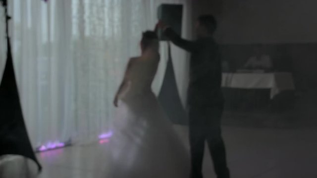 anonymous newlyweds, young married couple dancing first dance at a wedding