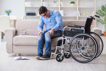 Young student on wheelchair in disability concept