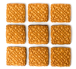 Cookies are laid out on a white. The view from the top.