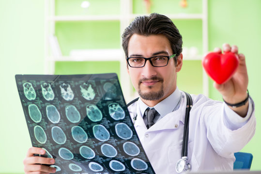 Doctor Radiologist Looking At X-ray Scan In Hospital