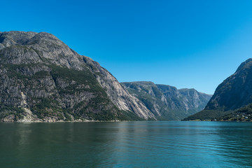 Naklejka na ściany i meble View of Hardanger Fjord rocks from the boat. National park Hardangervidda, Norway, Europe.