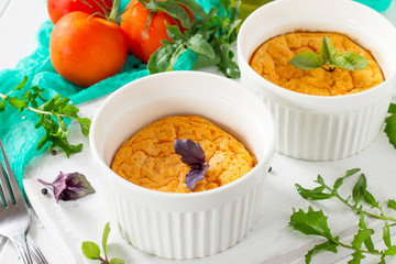Vegetarian vitamin breakfast French baked cheese souffle with tomato  on a wooden table. Vegan dish. Proper nutrition. Healthy lifestyle.