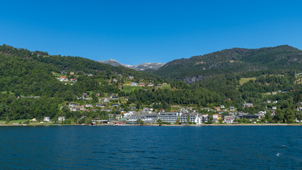 Fototapeta na wymiar Panorama of the village of Ulvik from fjord. National park Hardangervidda, Norway, Europe.