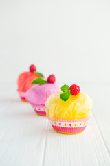 Concept of artificial, plastic food. GMO, E numbers and genetically modified sweets. Use of chemicals in the food industry. Future food Technology. Unhealthy snacks on white background. Copy space.