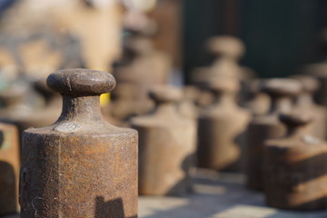 Old rusty weights of different sizes
