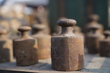 Old rusty weights of different sizes