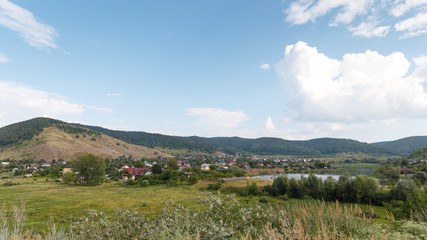 rural landscape on the mountains and a small river