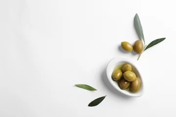 Foto op Aluminium Flat lay composition with fresh olives in oil on white background © New Africa