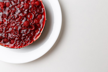 Raspberry jelly cake. Top view, flat, overhead. Copy space and text area. on white background