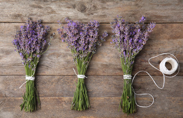 Flat lay composition with lavender flowers on wooden background