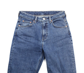 Stylish jeans on white background, top view