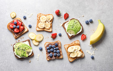 Tasty toast bread with fruits and berries on light background - obrazy, fototapety, plakaty