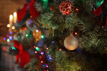 Christmas tree with beautiful decorations indoors, closeup. Stylish interior element