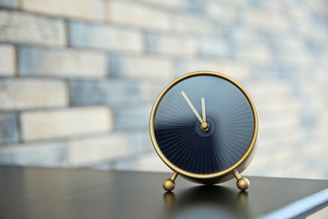 Alarm clock on table indoors. Time concept