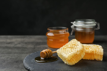 Slate plate with fresh honeycombs on table