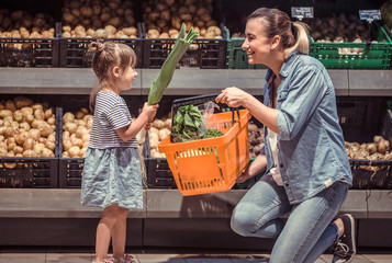 Mom and daughter are shopping at the supermarket