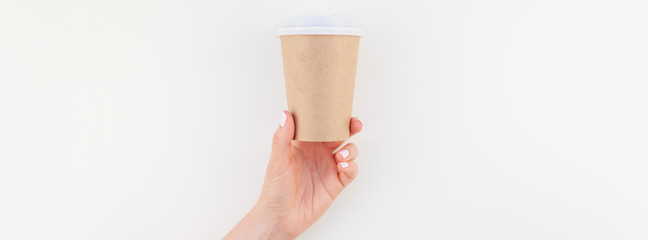Mock up of coffee cup in female hand