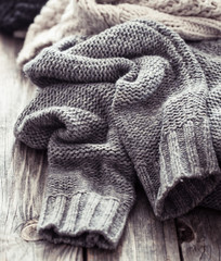 Knitted sweater on a wooden background