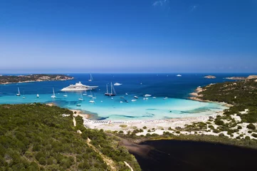Foto op Plexiglas Aerial view of an emerald and transparent mediterranean sea with a white beach and some yachts. Gulf of the Great Pevero, Costa Smeralda, Sardinia, Italy. © Travel Wild
