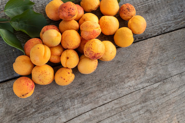 Naklejka na ściany i meble Delicious ripe apricots on wooden table, rustic.