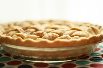 Low, horizontal image of a freshly baked homemade apple pie.  Shallow depth of field.