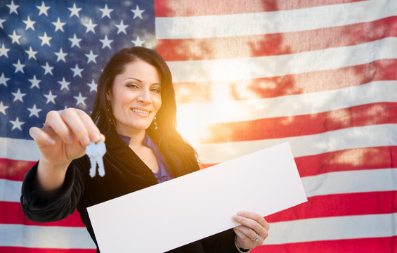 Hispanic Woman House Keys and Blank Sign In Front of American Flag