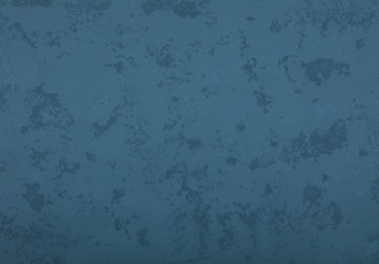 Grunge blue painted plaster wall background