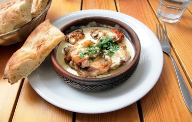 Chkmeruli - a traditional Georgian dish of chicken in garlic cream sauce