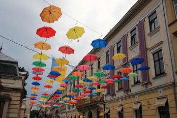 Colorful umbrellas in front of the entrance to the Potocki Palace, Lviv, Ukraine