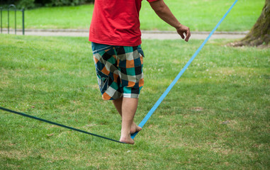 closeup of tightrope walker soft strap  in urban park