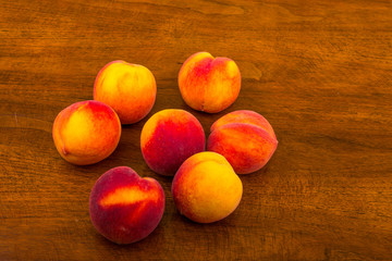 Fototapeta na wymiar Peaches on a Wood Table