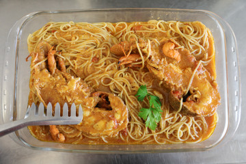 Tasty Greek cuisine seafood Slipper lobsters or Kolohtipa with spaghetti pasta makaronada in tomato...