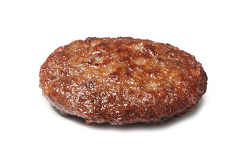 Single fried hamburger patty isolated on white background