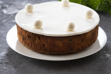 Christmas fruit cake, pudding on white plate. Copy space.