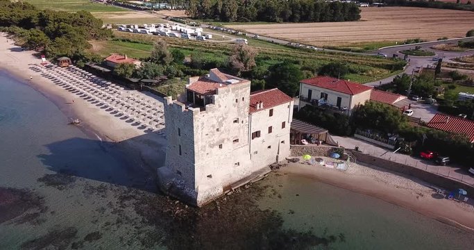 Torre Mozza, Piombino, Toscana, Italy  16 June 2018. Aerial view on the sea, beach and ancient fortress at morning light