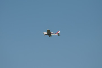 An airplane in the blue sky after take off.