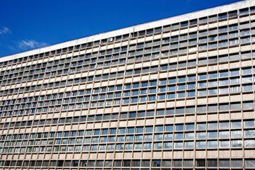 Industrial building exterior with geometric pattern on a summer day