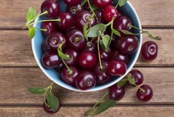 White plate of ripe cherries