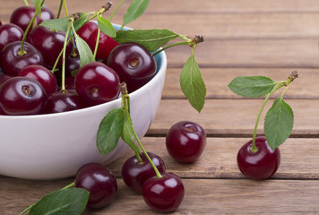 White plate of ripe cherries